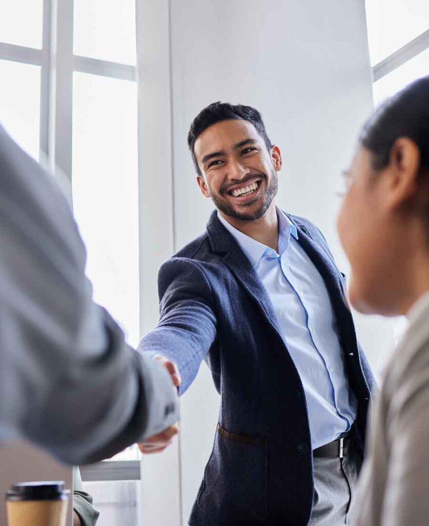 Temporary worker shaking the hand of his new boss.